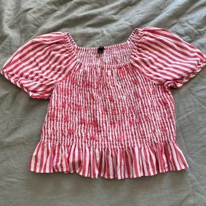 Salmon and white stripped peplum shirred top